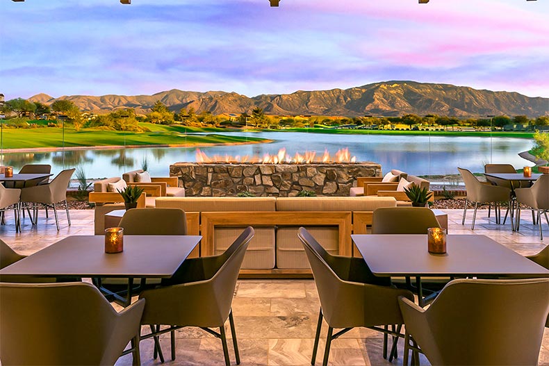 View of a picturesque lake and mountain range from the Ranch House patio at SaddleBrooke Ranch in Oracle, Arizona