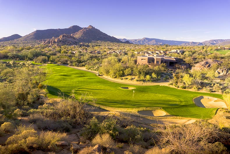 Aerial view of an Arizona golf course with mountains in background