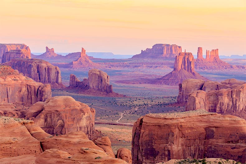 A sunrise over Hunts Mesa in Monument Valley, Arizona