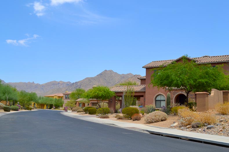 A blue sky over a Southwestern-style neighborhood in the mountains of the Arizona desert