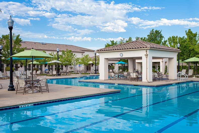 Blue sky over the outdoor pool and patio at Heritage Park in Sacramento, California