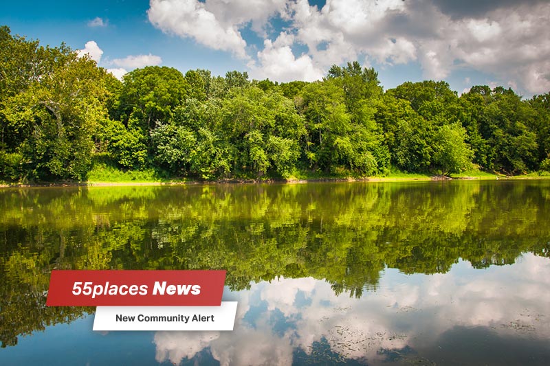 "New Community Alert" banner over trees along the Potomac River at Balls Bluff Battlefield Park in Leesburg, Virginia