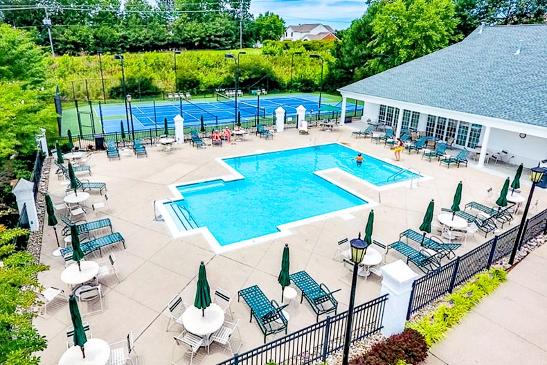 View of the outdoor pool and tennis court at CrossRidge in Glen Allen, Virginia