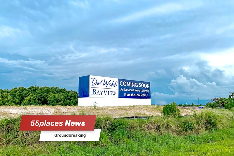 "55places News: Groundbreaking" banner over the "coming soon" community sign for Del Webb BayView in Palmetto, Florida