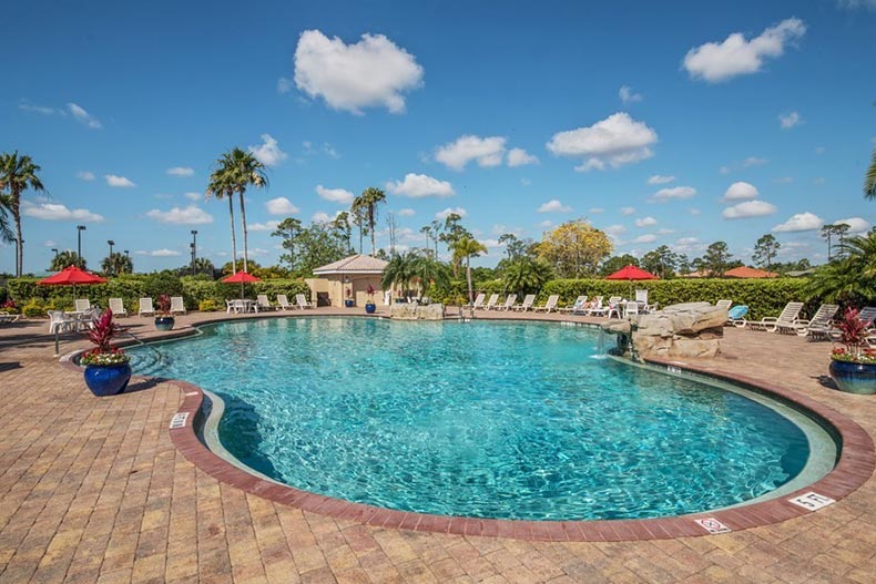 A blue sky over the outdoor pool at Heron Creek in North Port, Florida