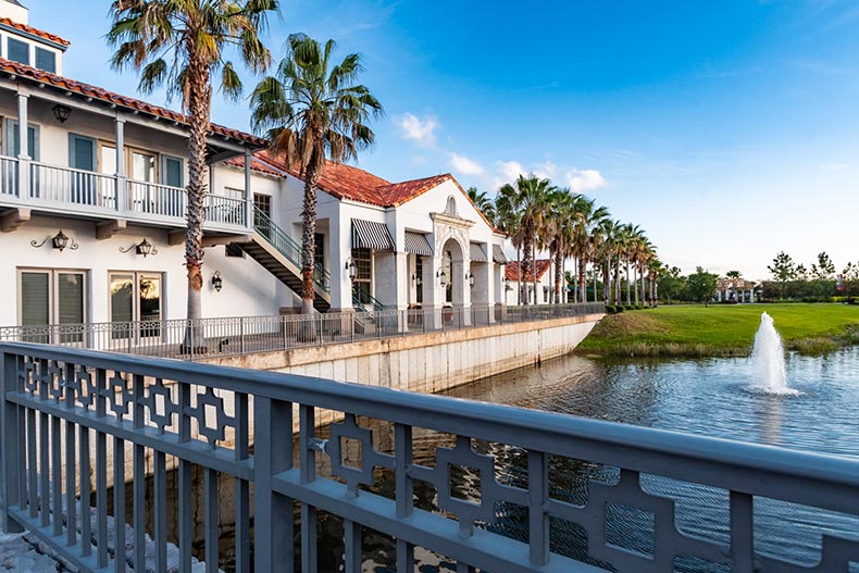 View from a bridge of a building overlooking a picturesque pond at Solivita in Kissimmee, Florida