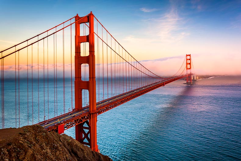 Sunset view of the Golden Gate Bridge and fog from Battery Spencer in San Francisco, California
