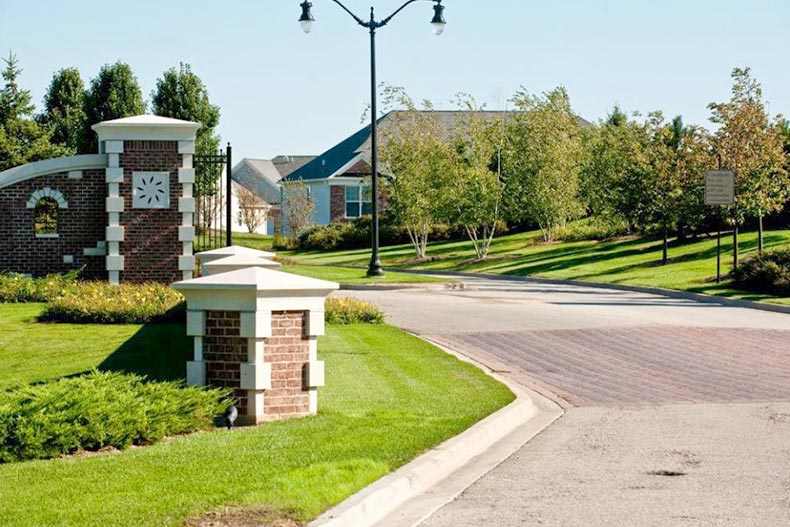 View of the entrance to Grand Dominion in Mundelein, Illinois on a sunny day
