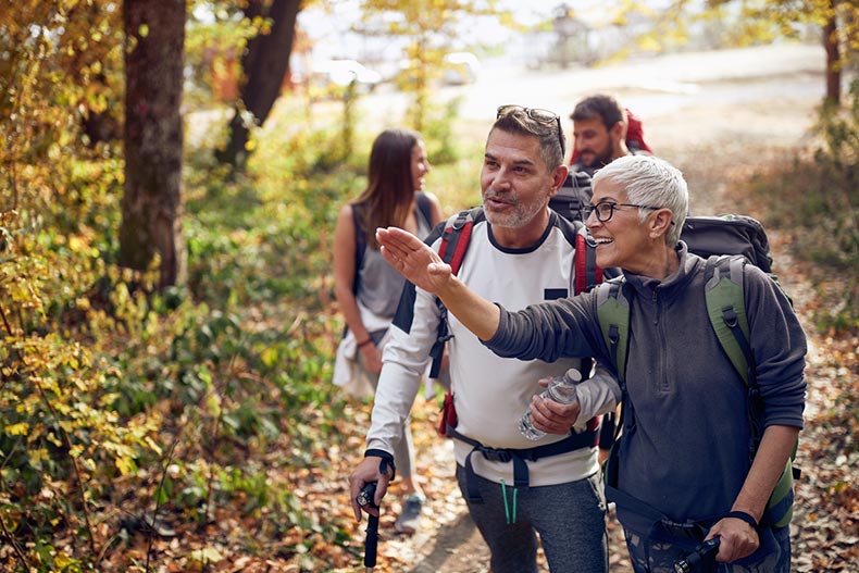 Older adults enjoy a trail, which is located within their 55+ community
