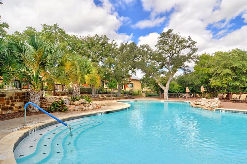 View of the outdoor pool and patio at Sun City Texas in Georgetown, Texas