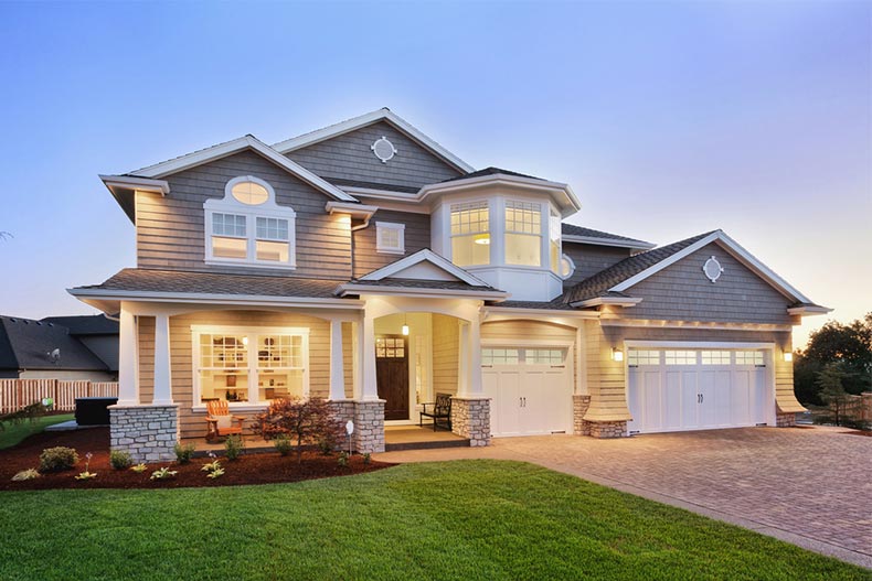 Exterior view of a new luxury home at twilight