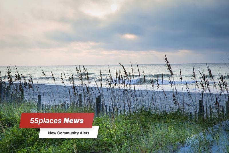 "New Community Alert" banner over the shore of Myrtle Beach, South Carolina