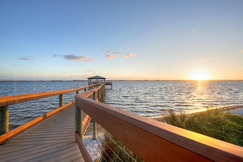 A sunrise view of a pier along the Indian River in Melbourne, Florida