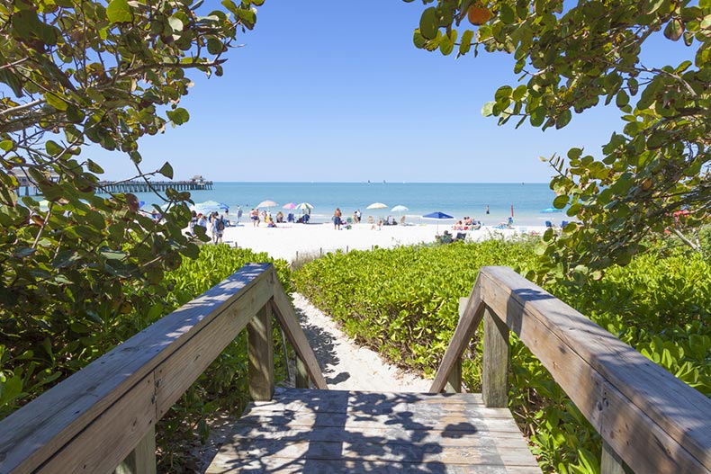 Access path to a white sand beach in Naples, Florida