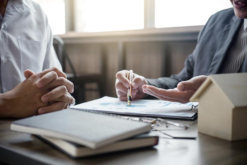 A real estate agent guiding a homebuyer through the negotiation process