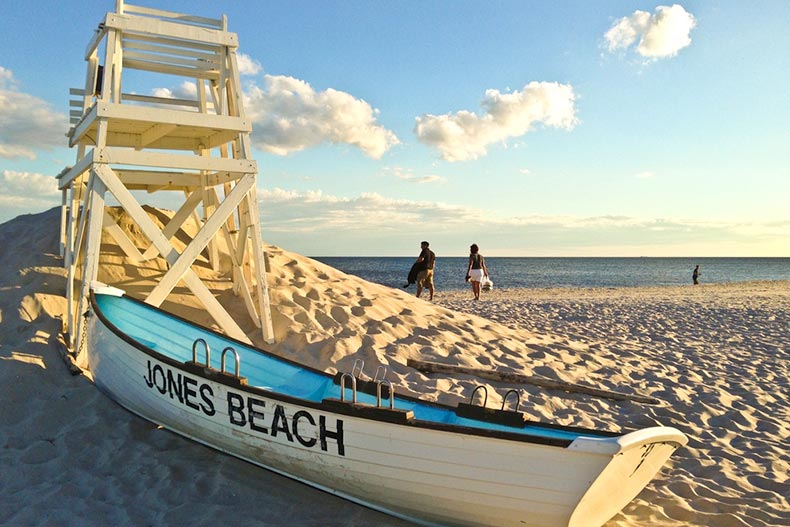 View of a life guard stand and row boat on the sand at Jones Beach in Long Island, New York