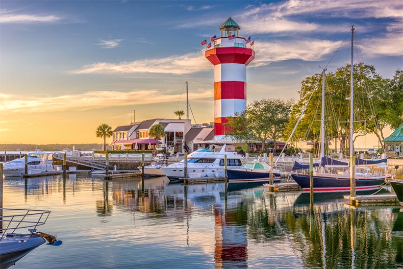 View of a lighthouse and docks at dusk in Hilton Head, South Carolina