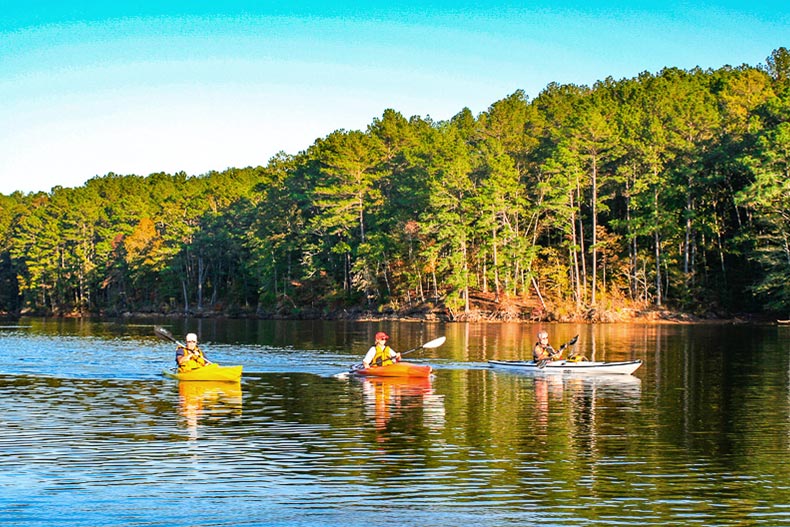 Kayakers on a calm lake at Savannah Lakes Village in McCormick, South Carolina