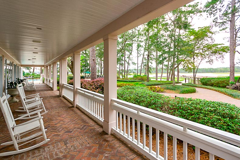 Rocking chairs sitting on the porch of a clubhouse at Sun City Hilton Head in Bluffton, South Carolina