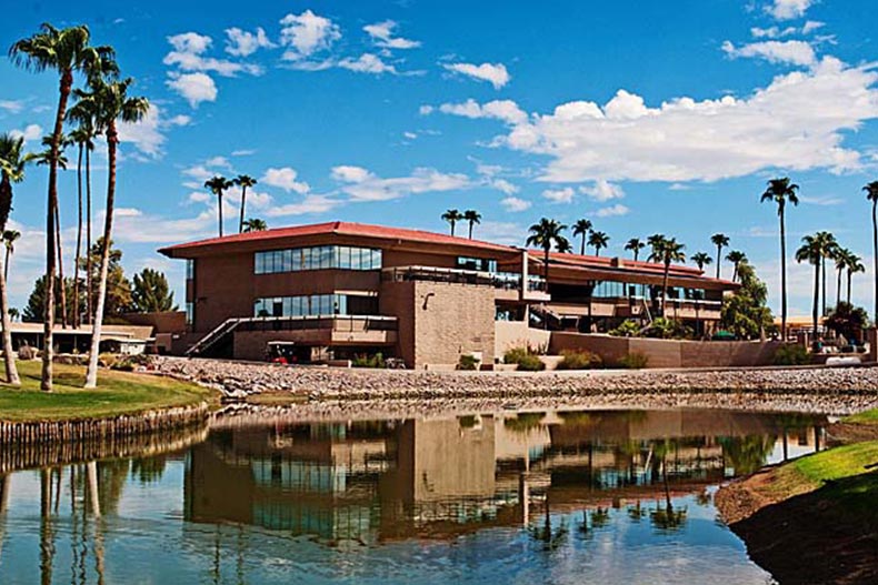 Palm trees and a pond beside the clubhouse at Sunbird in Chandler, Arizona