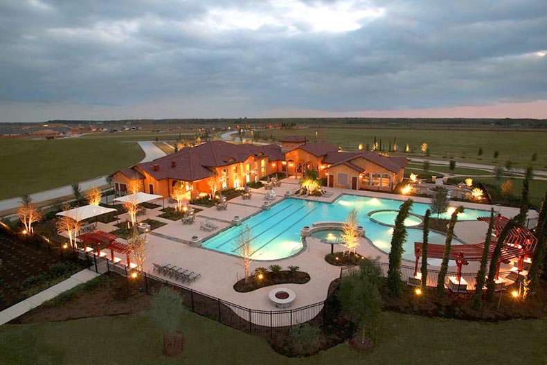Aerial nighttime view of the amenities at The Village at Tuscan Lakes in League City, Texas