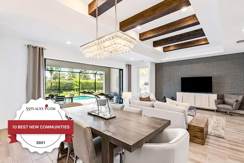 "10 Best New Communities" badge over a model home at Del Webb BayView in Parrish, Florida