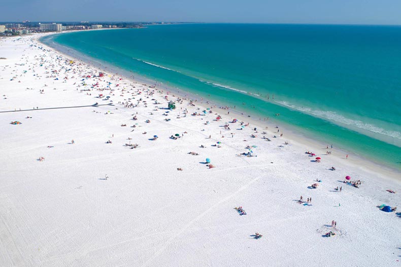 View of Siesta Key Beach in Sarasota, Florida shot by aerial drone on a sunny day