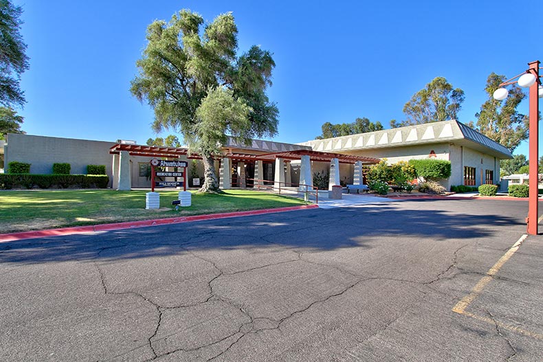 Exterior view of the entrance and community building of Ahwatukee Retirement Village in Phoenix, Arizona