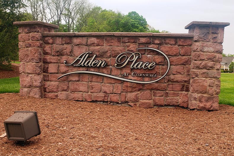 The brick Alden Place welcome sign surrounded by wood chips in Lebanon, Pennsylvania
