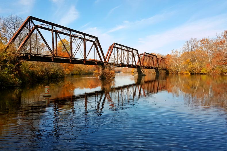 An old metal bridge over a river in autumn located in Allentown, Pennsylvania