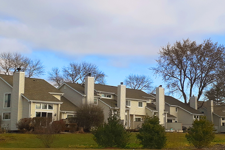 A back view of single-family homes with open backyards located in Atwater Ranches, Naperville, Illinois