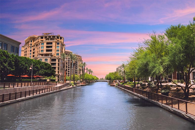 Trees and buildings lining the waterfront in Scottsdale, Arizona