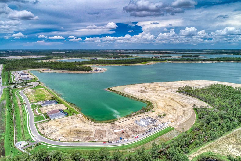Aerial view of a scenic lake at WildBlue in Estero, Florida