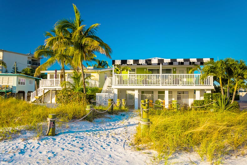 Palm trees and beach houses at Fort Myers Beach in Florida