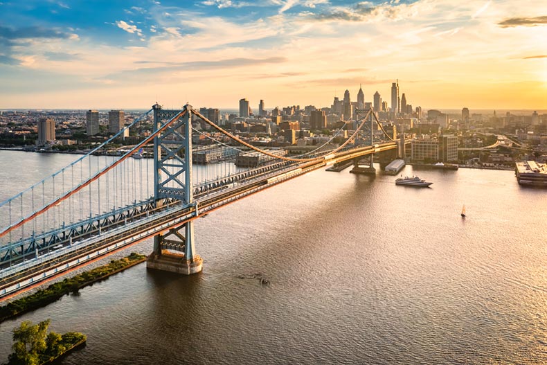 Aerial view of the Ben Franklin Bridge and Philadelphia skyline at sunset