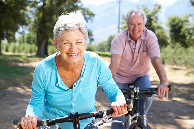 Senior couple on country bike ride on a sunny day