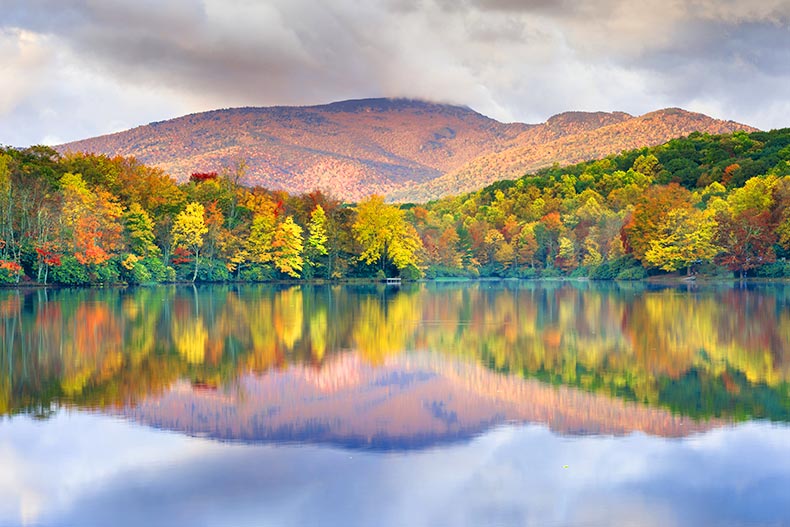 Photo of the Blue Ridge Mountains of North Carolina reflected on a lake in the Valley