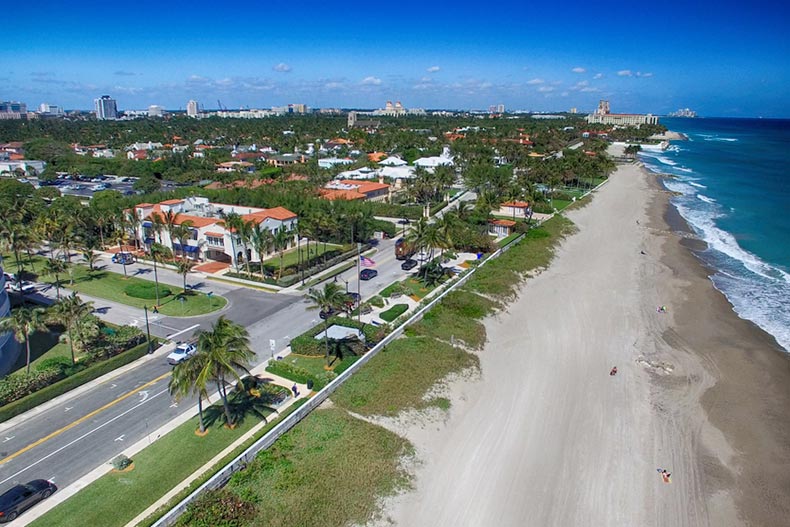 An aerial view of houses along the coast in Palm Beach, Florida