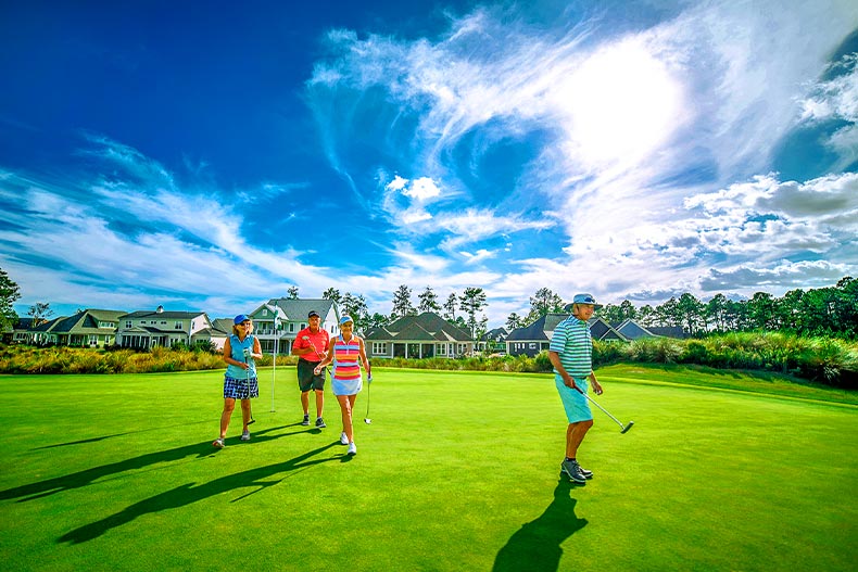 Four golfers on a course during the day at Brunswick Forest in Leland, North Carolina