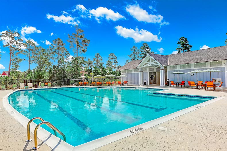 View of the outdoor pool and patio at Brunswick Forest in Leland, North Carolina