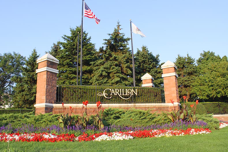 Greenery surrounding the community sign for Carillon in Plainfield, Illinois