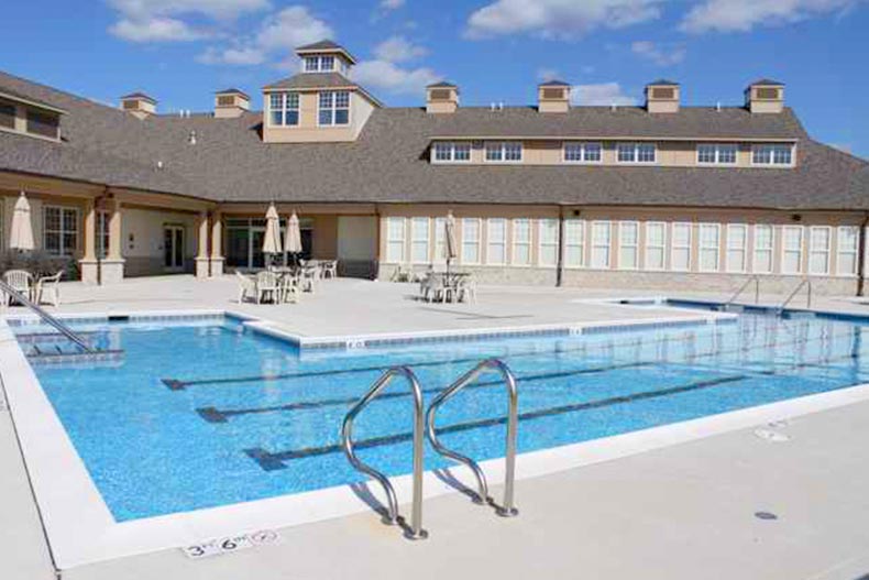 View of the outdoor pool and patio at Carillon at Cambridge Lakes in Pingree Grove, Illinois