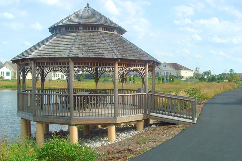 A gazebo beside a picturesque pond at Carillon at Stonegate in Aurora, Illinois