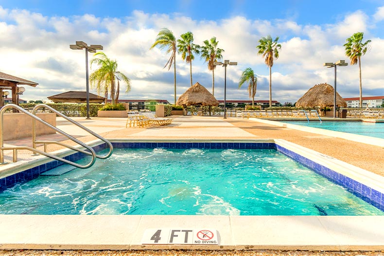 View of a bubbling whirlpool spa and patio in Century Village and Pembroke Pines in Pembroke Pines, Florida