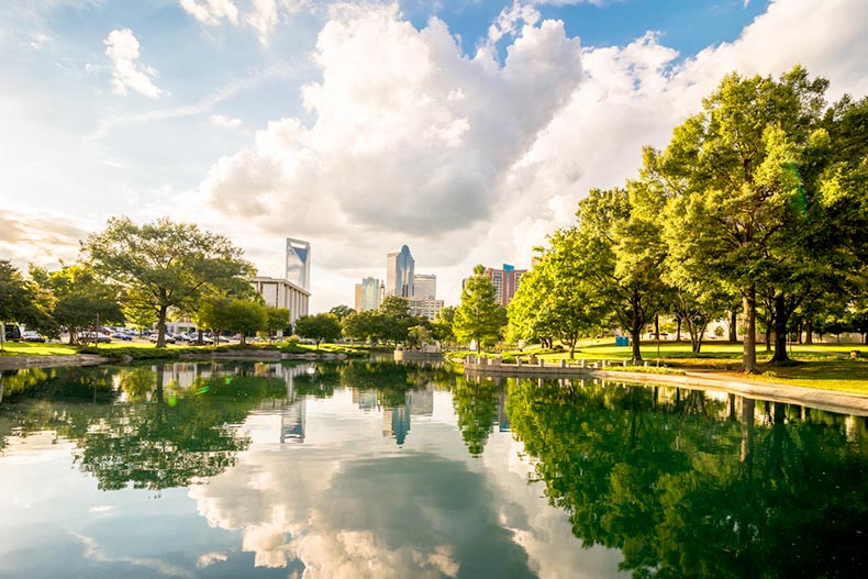 View of the Charlotte, North Carolina skyline from Marshall Park with the reflection of the clouds and buildings in the water