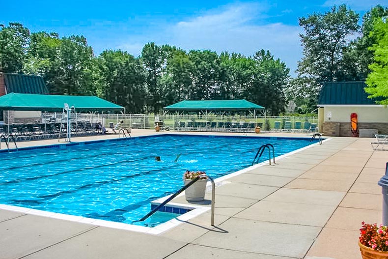 The outdoor pool and patio at Clearbrook in Monroe, New Jersey