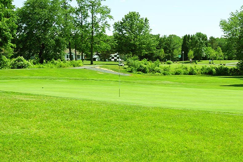 A checkered flag in the middle of the golf course in Clearbrook, located in Monroe, New Jersey