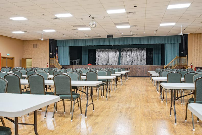Tables and chairs facing a stage at Holiday City at Berkeley in Toms River, New Jersey