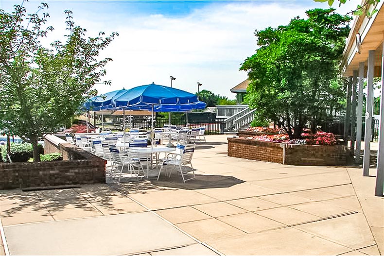 Tables and chairs on a patio at Concordia in Monroe, New Jersey