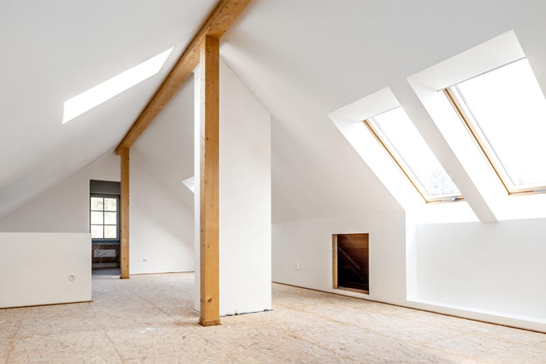 An old attic being converted into a spacious living room